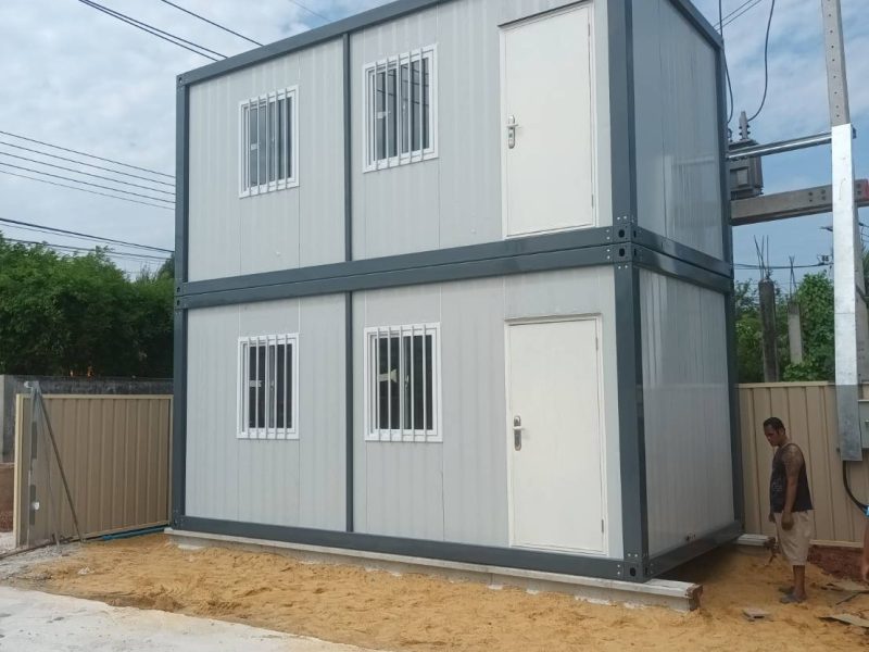 Two-story residential container unit with dark trim