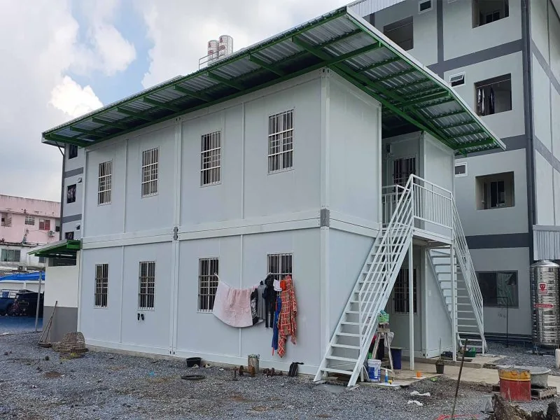 Large two-story container building with external stairs