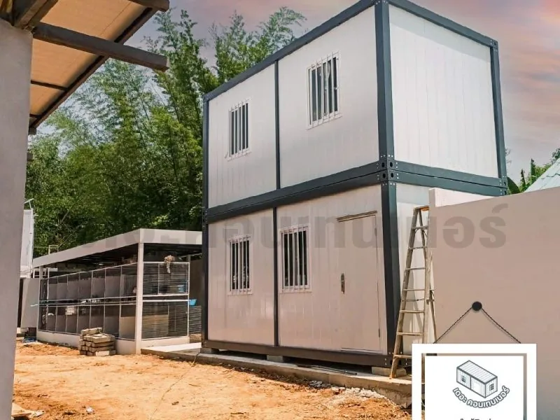 Two-story container house with an adjoining utility yard